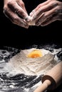 Close up of mans hands using eggs for a dough Royalty Free Stock Photo