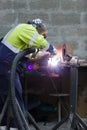 close up mans hands working with circular grindstone