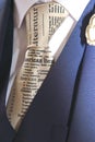 Close up of a mans newspaper print tie