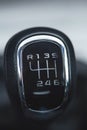 Close up of the manual gearbox transmission handle. Accelerator handle and buttons in a new car. Auto interior detail. Royalty Free Stock Photo