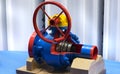 Close up of manual operate blue metal ball valve and pipes industrial equipment at factory.