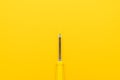 Close-up of screwdriver on yellow background Royalty Free Stock Photo