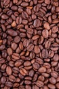 A close up of many brown coffee beans