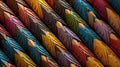 a close up of many different colored pencils in a row on a table with a black background and a red, yellow, blue, green, orange, Royalty Free Stock Photo