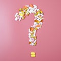 Close up of many different pills in question mark sign form on pink background Royalty Free Stock Photo