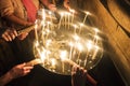 Close up of many hands burning candles after the Holy Fire miraculously appeared at Temple of the Lord's Coffin, Jerusalem, Israe