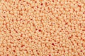 Close-up of sandy brown seed beads. Royalty Free Stock Photo