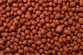 Close up of many small brown seeds or pellets filling the frame Royalty Free Stock Photo