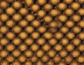 A close up of many small gold colored balls Royalty Free Stock Photo