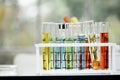 Close up of Many test tube with many color of liquid arrange in tray