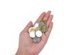 Close-up of many Thai baht coins in the hands of women on white background Royalty Free Stock Photo