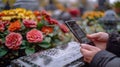 Close-up of marble tombstone with QR code, smartphone scanning, blurred flowers symbolize remembrance. Digital memory