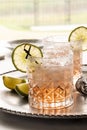 Close up of a margarita cocktail with a salted rim and garnished with a slice of lime. Royalty Free Stock Photo