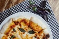 Close-up of Margarita pizza in a disposable dish. Top view of takeaway food in a fast food cafe. On photo - mozzarella cheese, Royalty Free Stock Photo