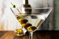 Close-up of a martini glass with olives on a light background Royalty Free Stock Photo