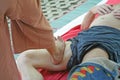 Massage with feet and heat Yam khang,Treatment of traditional aches and pains,The treatment is to use the foot with herbs and Royalty Free Stock Photo