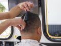 Close-up, master hairdresser does haircut and style with scissors and comb. Concept Barbershop Royalty Free Stock Photo