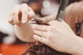 Close-up, master hairdresser does hairstyle with scissors comb. Concept Barbershop Royalty Free Stock Photo