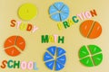 Close up mathematical fractions and colorful letters on yellow background. Creative, fun mathematics banner. Education,