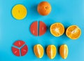 Close up mathematical fractions and oranges as a sample of parts on blue background. Creative, fun mathematics banner. Education