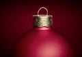 Close up of matte red christmas ball against dark red background Royalty Free Stock Photo