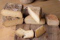 close up of maturated selection of cheese on old wood