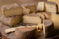 close up of maturated selection of cheese on old wood