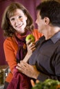 Close up of mature couple together in kitchen Royalty Free Stock Photo