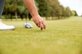 Close Up Of Mature Male Golfer Preparing To Hit Tee Shot Along Fairway With Driver Royalty Free Stock Photo