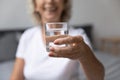 Close up of elderly woman recommend water drinking