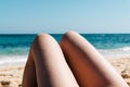 Mature woman legs sunbathing on the beach Royalty Free Stock Photo