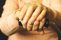 Close up of mature womans hands. Health care giving, nursing home. Parental love of grandmother. Old age related diseases. Royalty Free Stock Photo