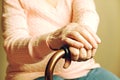 Close up of mature womans hands. Health care giving, nursing home. Parental love of grandmother. Old age related diseases. Royalty Free Stock Photo