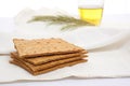 close-up of matzah bread on a white tablecloth