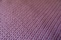 Close up of mauve handmade stockinet fabric Royalty Free Stock Photo
