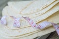 Close up of measuring tape on low carb tortillas or naan bread