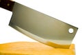 Close-up of meat cleaver with cutting board