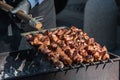 Close up of meat skewer, grilled in a barbecue, shashlik or shashlyk