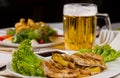 Close up Meat and Vegetable Dish with Beer Royalty Free Stock Photo