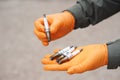 Close up mechanic hands hold old spark plug, spare part of car engine. Royalty Free Stock Photo