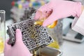 Mechanic man pouring liquid purified oil on automobile part Royalty Free Stock Photo