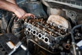 Man working in garage, workshop, auto servicing center. Royalty Free Stock Photo