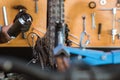 close up of a mechanic's hand wearing gloves using chain lube lubricating the chain and freewheel