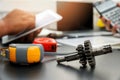 Close Up mechanical gear parts on office desk with engineers working background