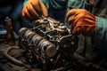close-up of a mechanics hands repairing an engine