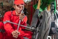 Close up of mechanics use wheel nuts to remove motorcycle wheels