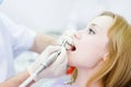 Close-up medical dentist procedure of teeth polish