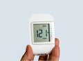 Close up medical device,digital handheld blood sugar detector isolated on white background. Royalty Free Stock Photo