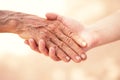 Close up medical doctor holding senior woman`s shaking hands Royalty Free Stock Photo