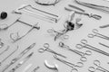 Close-up on medical instruments used for surgical operations, a gray background